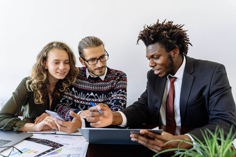 black tax consultant helping couple with taxes