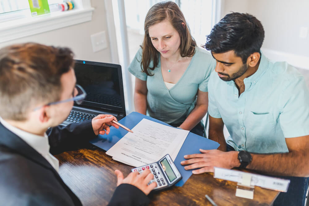 couple with consultant calculating tax debt