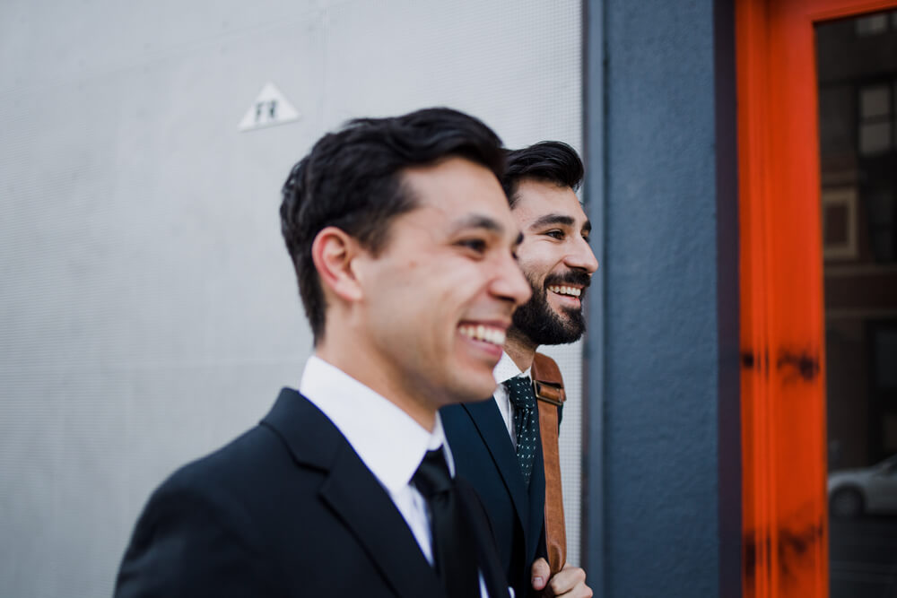two tax consultants in suits laughing two tax consultants in suits laughing